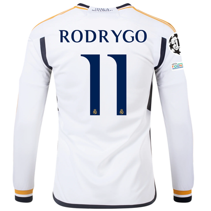 adidas Real Madrid Long Sleeve Rodrygo Home Jersey w/ Champions League + Club Wo